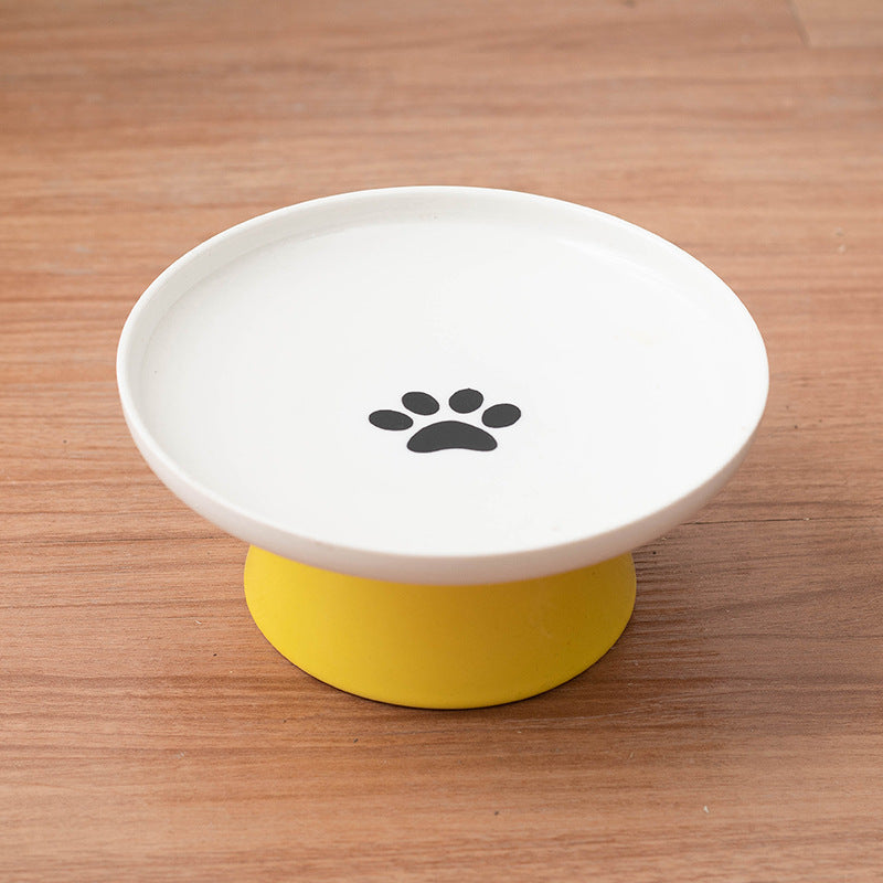Yellow ceramic raised cat bowl.