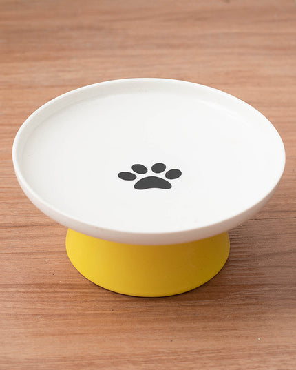 Yellow ceramic raised cat bowl.