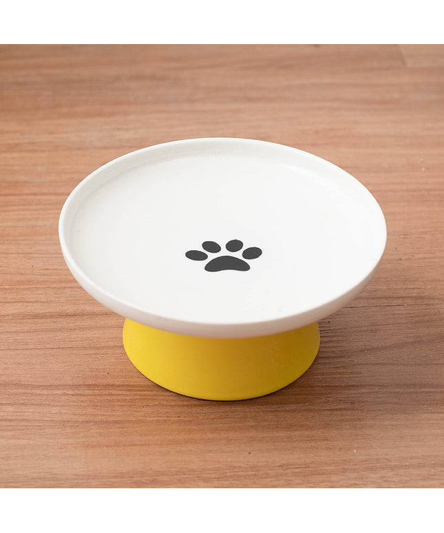 Yellow ceramic raised cat bowl.