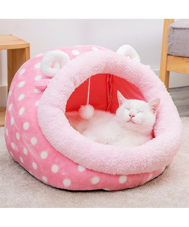 Cat sleeping in a warm semi-enclosed cat bed.